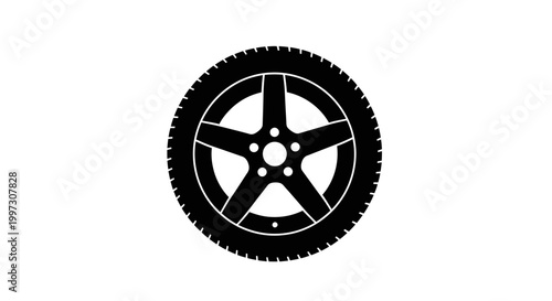 A black tire with a five spoke wheel a stark silhouette