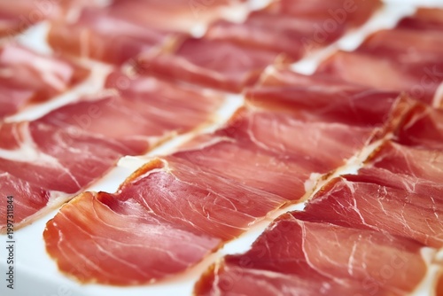 Sliced Ham Arranged on a Tray in a Kitchen Setting With Natural Light