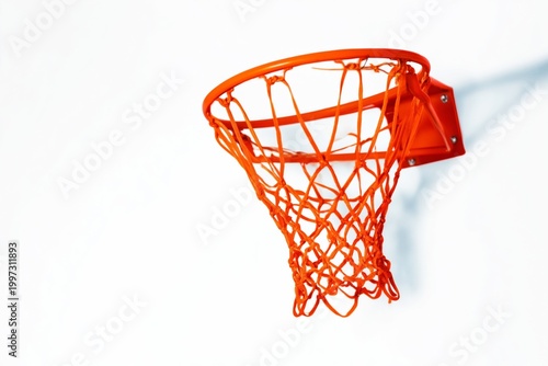 Basketball Hoop Hanging on a Wall With Bright Orange Net in a Gym or Playgrou...