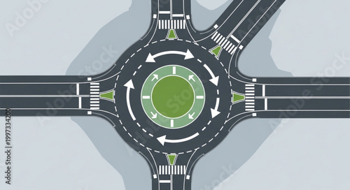 Aerial view of a modern roundabout intersection with traffic flow arrows.