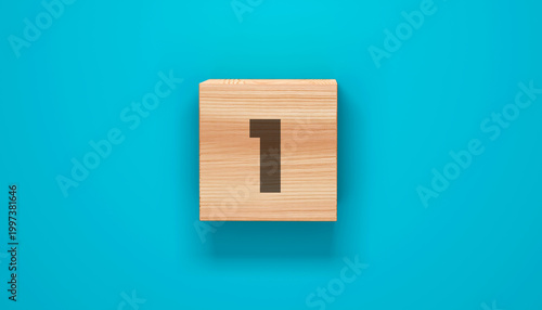 Obraz na płótnie Number One: A close-up view presents a singular wooden block, prominently displaying the numeral 1 at the center, resting against a vibrant azure backdrop