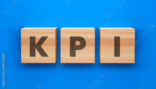 Quadro su tela KPI Blocks: Three wooden blocks, artfully arranged, spell out KPI against a vibrant blue background, symbolizing Key Performance Indicators and their pivotal role in business strategy
