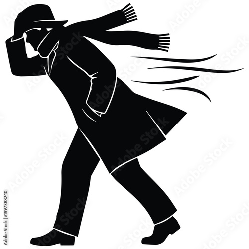  Man silhouette walking against strong wind with a coat and scarf