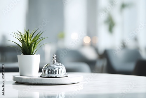 Close-up of hotel reception bell with blurred background of guests and staff, bright interior, hospitality concept, customer service orientation, modern reception desk environment. Copy space. Banner
