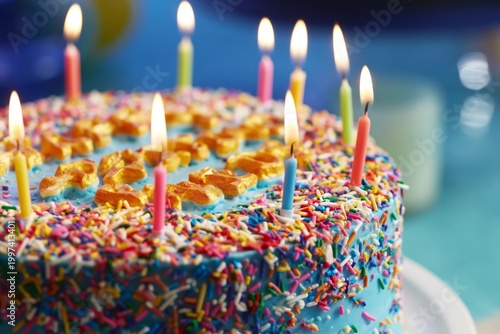 Birthday Cake With Candles and Colorful Sprinkles on a Table at a Celebration