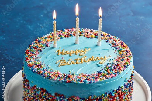 Birthday Cake With Candles and Colorful Sprinkles on a Table at a Celebration