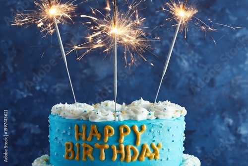 Birthday Cake With Blue Frosting and Sparklers on a Table for Celebration Event