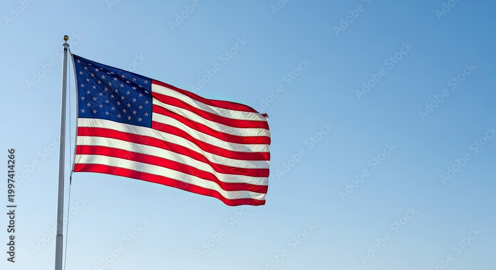 Obraz premium Celebrating independence day american flag waving against a clear blue sky