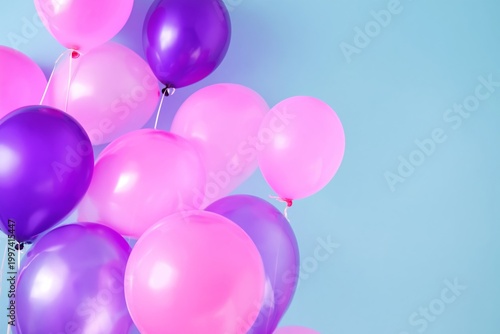 Balloons in Shades of Pink and Purple on a Light Blue Background at a Celebra...