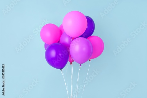 Bright Balloons in Pink and Purple Colors Floating Against a Blue Background ...