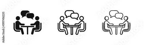 Two People Sitting at Table Talking with Speech Bubbles Icon Set