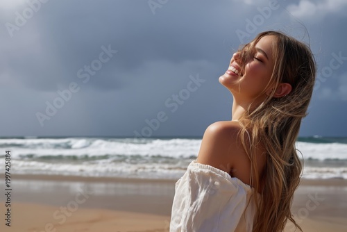 Woman Smiles at the Beach During a Cloudy Day With Waves in the Background