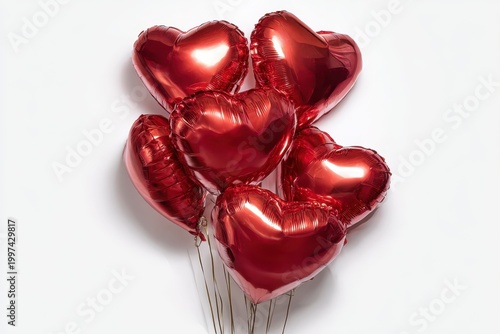 bunch of shiny red heart shaped foil balloons isolated on white background