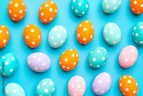 Colorful Eggs Laid out on a Blue Surface for a Festive Celebration During Spr...