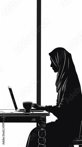 Muslim woman working on laptop while sitting at a table indoors  