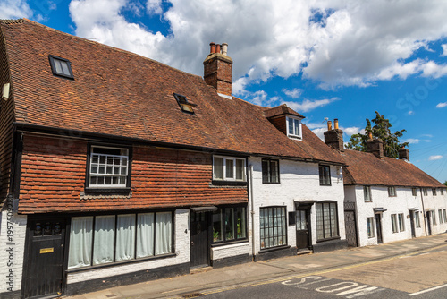 Traditional Terraced Houses on Street in Battle, East Sussex, England, UK under Blue Sky