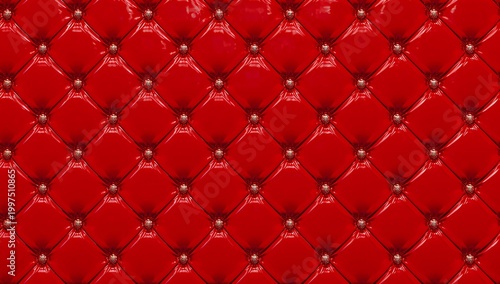 Close up of rich red tufted upholstery with brass nailhead trim