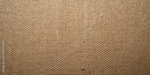 A macro view of a rough brown fabric and leather texture showcasing a woven pattern of beige canvas fibers on an old sackcloth surface backdrop