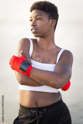 Determined young black woman training for boxing