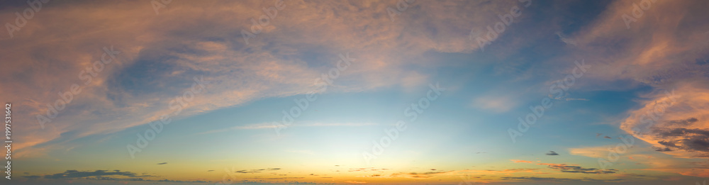 Fototapeta premium Beautiful sunset sky scenery. Bright colorful orange and yellow clouds on horizon