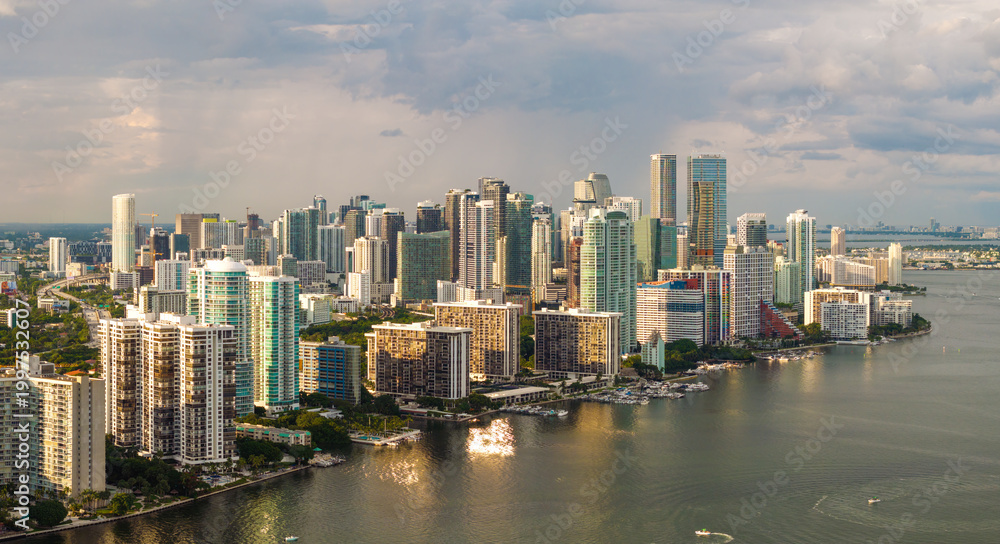 Fototapeta premium Miami, coastal city in Florida. Waterfront skyscraper buildings in downtown district of USA urban area. American megapolis with business financial district