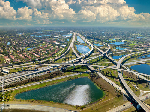 USA car urban transportation infrastructure. American highway junction with fast driving vehicles in Miami, Florida