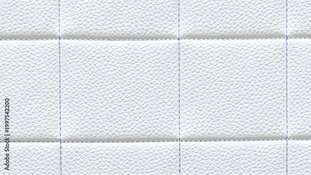 Naklejka premium The surface texture of white faux leather, stitched in diamond, square, and rectangular patterns. Quilted eco-leather