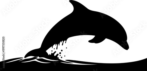 Playful dolphin silhouette leaping out of the wavy water