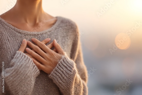 Woman meditating with hands on heart