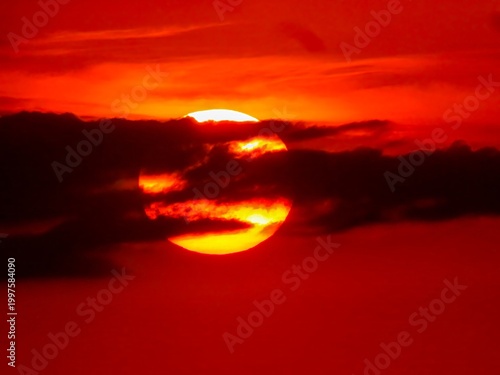 Fiery Sunset Over Clouds