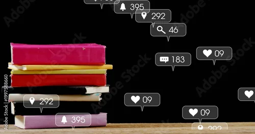 Fototapeta Displaying bright hardbacks left on table with black backdrop and rising notifications, copy space