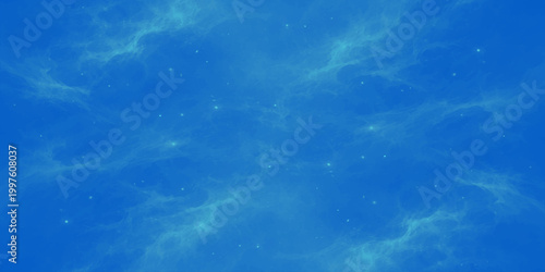 Bright fluffy white clouds drift across a clear blue sky background on a sunny summer day creating a beautiful high atmosphere nature cloudscape