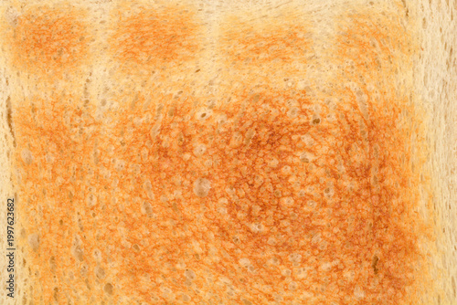 Konstfotografi A close up shot shows the golden brown and crispy texture of a single slice of t