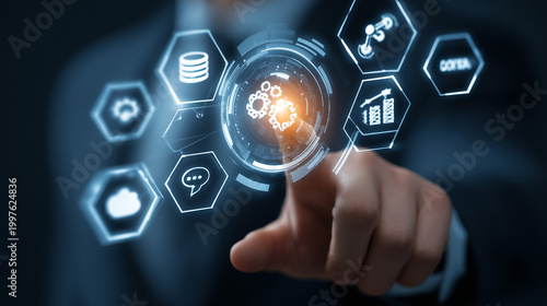 Hand interacting with digital technology interface featuring gear and globe icon, cloud data and connectivity symbols on futuristic blue background