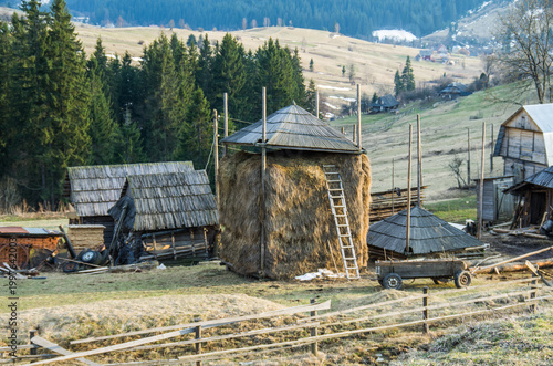 Haystack and Wooden Farm Buildings in Mountain Village