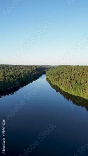 Aerial Drone View of Kaukajärvi in Kangasala on a Sunny Summer Day. Scenic aerial drone view of Kaukajärvi lake in Kangasala, Finland, captured on a bright sunny summer day.