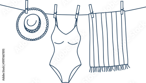 Blue line of a swimsuit hat and towel drying on a clothesline beachwear