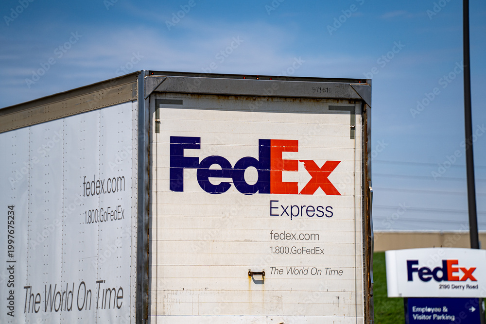 Fototapeta premium Rear view of FedEx Freight truck driving on road in Toronto. Toronto, Canada - April 23, 2026.