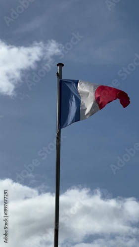 French flag waving on pole