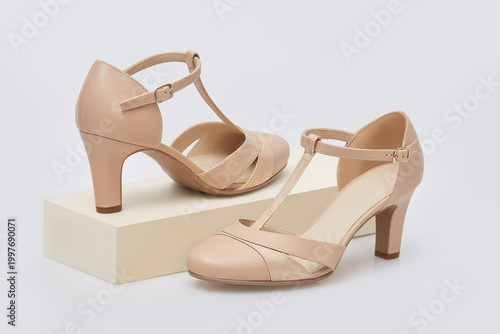 Fotografi Elegant nude t strap mid heel pumps for women with closed round toe, crossover v
