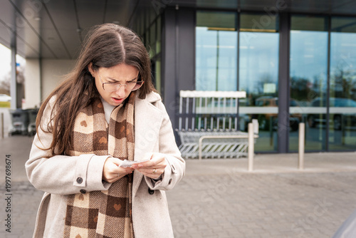 Young Woman Reacting to High Cost Grocery Receipt