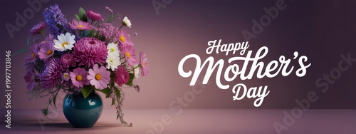 Hand holding bouquet of purple flowers with Happy Mothers Day text on soft pink background.