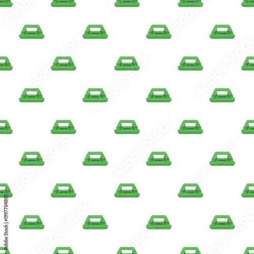 Green paper hole punchers creating a repeating seamless pattern on a white background