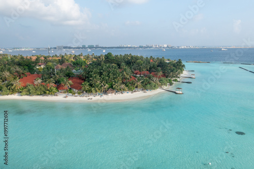 Canvas Print High altitude Maldives aerial view islands with Malé city in far distance over o