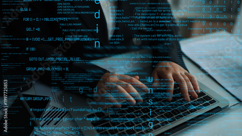 Fényképezés Close-up view of hands actively typing on a laptop keyboard, surrounded by streams of code and data in a contemporary workspace