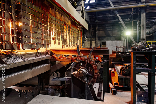 Rolled metal factory. Roller conveyor of metal rolling mill
