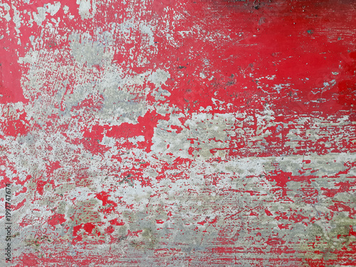 Peeling red paint on concrete wall grunge textured rough surface. vintage abstract background