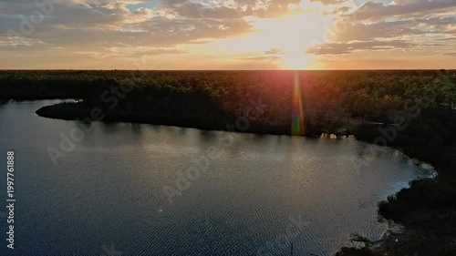 Drone footage of a sunset over a Florida lake made by a sinkhole