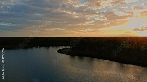 Drone footage of a sunset over a Florida lake made by a sinkhole