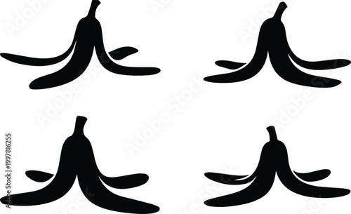 Minimalist black banana peel on the floor representing a classic comedy prank and slipping hazard silhouette vector icon